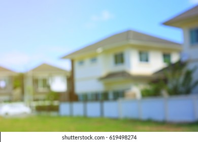 residential house village suburb with grass field playground, image blur background