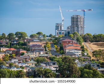 Residential Houses In Melbourne's Suburb With New Apartment Buildings Under Construction In Distance. City Of Maribyrnong, VIC Australia.