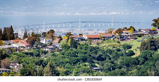 Residential Neighborhood On The Hills Of San Francisco Peninsula, Silicon Valley, San Mateo Bridge In The Background, California