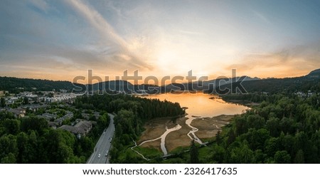 Residential Neighborhood and Park in Suburban City. Port Moody, Vancouver, BC, Canada. Aerial. Sunset Sky
