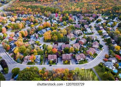 Residential neighbourhood in the suburbs of Montreal during autumn season in Quebec, Canada, aerial view. 
