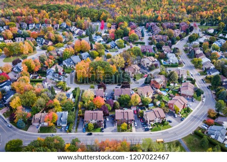 Residential neighbourhood in the suburbs of Montreal during autumn season in Quebec, Canada, aerial view. 
