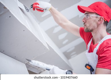 Residential Remodeling Drywall Patching. Caucasian Contractor In His 30s. Construction Theme.