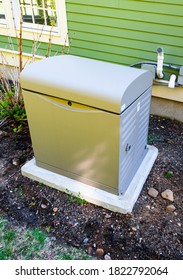 Residential Standby Generator Installed On A Concrete Pad