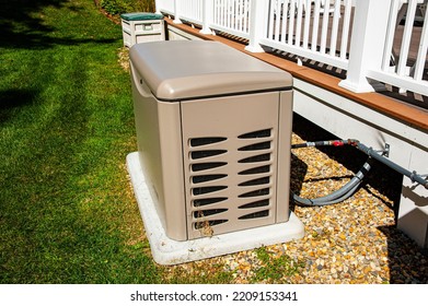 Residential standby generator on concrete pad