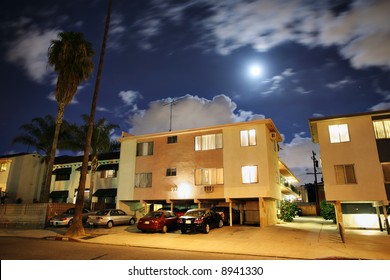 Residential Street With Apartment Buildings At Night In Los Angeles, California.