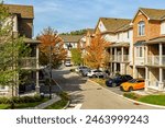 Residential townhouses. Modern apartment buildings in Ontario, Canada. Real estate development, street photo
