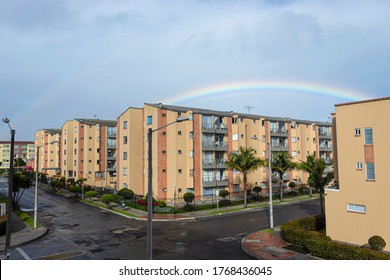 Residential Unit Neighborhood
At Sunny And Rainy Morning With Rainbow And Dark Cloudy Sky