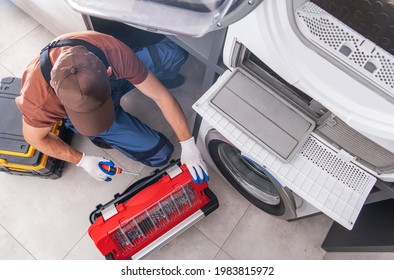 Residential Washing Machine Fixing By Caucasian Professional Technician. Home Appliances Issues Theme.