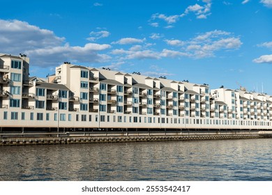 Residential waterfront apartment building. Waterfront architecture. Building with residential apartment at the river. Riva Pointe residential apartment building. modern architecture - Powered by Shutterstock