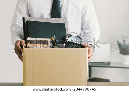 Resignation. businessmen holding boxes for personal belongings and resignation letters.Quitting a job,The big quit.The great Resignation. Foto d'archivio © 