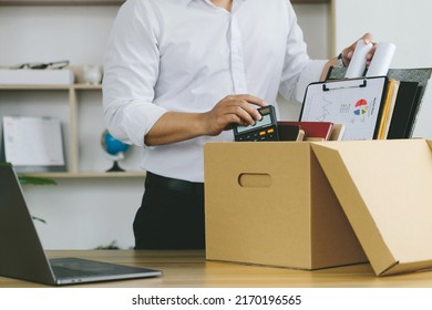Resignation.Businessmen Packing Stuff Resign Depress Or Carrying Business Cardboard Box By The Desk In The Office. Quitting A Job, The Big Quit. The Great Resignation.Unemployment