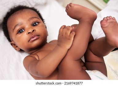 The Resilience Of A Child Is Admirable. Shot Of A Little Baby At A Checkup With A Doctor At A Clinic.