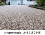 Resin driveway leading up to a large residential property