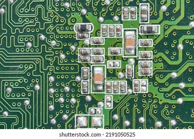 Resistors, capacitors, transistors on an electronic computer printed circuit board