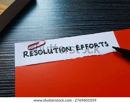 Resolution efforts writting on table background. 