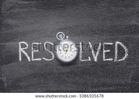 resolved word handwritten on chalkboard with vintage precise stopwatch used instead of O