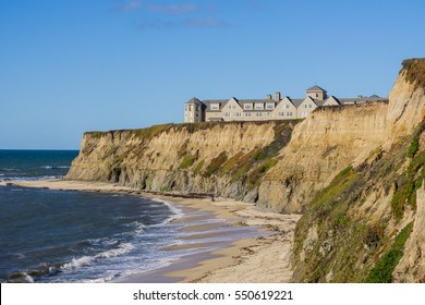 Resort on top of eroded cliffs and sandy beach, Pacific Ocean, Half Moon Bay, California