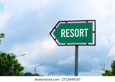 Resort Road Sign with Dramatic Clouds and Sky.