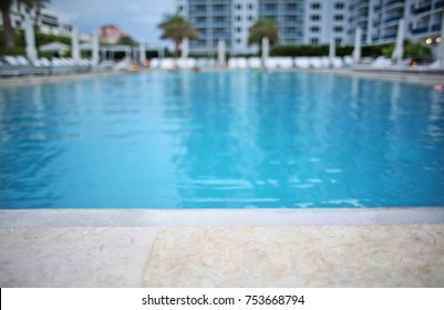 Resort Swimming Pool with No People and Hotel and Palm Trees - Shutterstock ID 753668794
