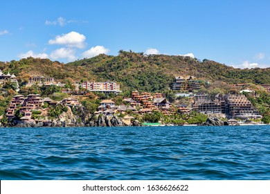 Resorts, hotels, vacation rentals and developments under construction dot the hillside and cliffs of Zihuatanejo, Mexico