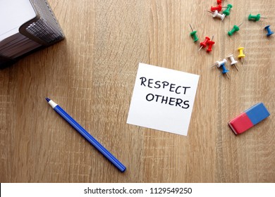 Respect Others Concept With Message On Wooden Table