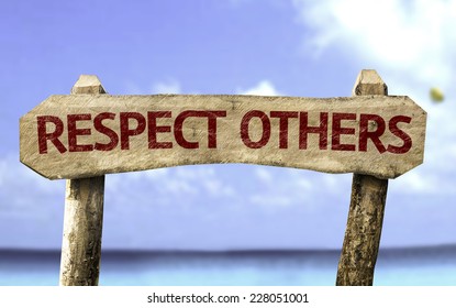 Respect Others Wooden Sign With A Beach On Background