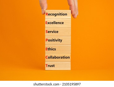 RESPECT symbol. Blocks with abbreviation RESPECT - recognition excellent service positivity ethics collaboration trust. Orange background, copy space. Businessman hand. Business RESPECT concept.