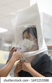 Respirator Fit Test Prepared For COVID-19. Asia Woman Testing Repiratory System With N-95 Surgical Mask To Checks Properly Fits Face To Wears.