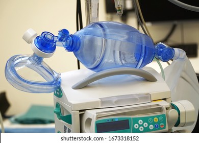 Respiratory mask with resuscitator for ventilation of a patient with pneumonia in the operating room of a hospital                               