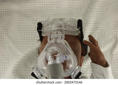 Respiratory Syncytial Virus Concept. African American Baby Wearing A Nebuliser Mask. Represented By A Reborn Doll: Lancashire, UK, 05-07-2021