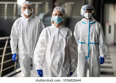 Response Team In Hazmat Suits With Protective Equipment