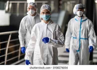 Response Team In Hazmat Suits With Protective Equipment