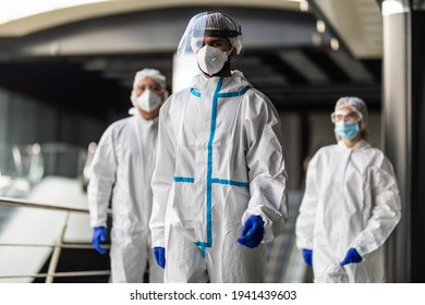 Response Team In Hazmat Suits With Protective Equipment