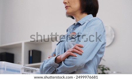 Responsible activist observing the election process at a polling station, democracy