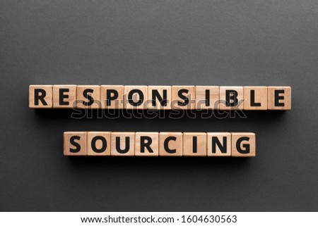 Responsible sourcing - word from wooden blocks with letters, responsible sourcing concept, gray background