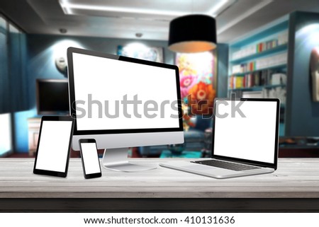 Responsive display devices on table in living room. Isolated white screen for mockup presentation.