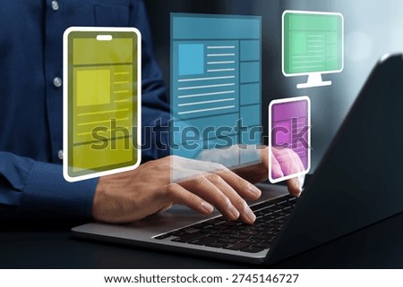 Responsive web design. Interface for enhancing user experience. Web designer using laptop computer to create wireframe.