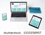 Responsive web design on laptop, tablet computer and mobile phone with clipping path from above.