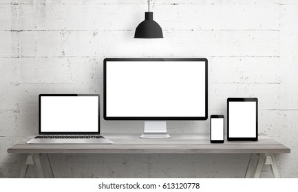 Responsive web site mockup. Computer display, laptop, tablet and smart phone on desk with isolated, blank, white screen for design presentation. - Powered by Shutterstock