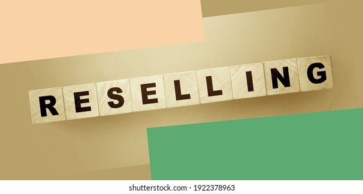 Resselling word wooden cubes on the green background. Business model concept. - Shutterstock ID 1922378963
