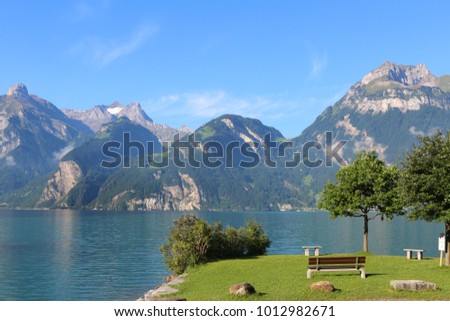 Rest area at the Lake Lucerne with beautiful panoramic view on the Swiss Alps Imagine de stoc © 