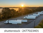 Rest area for semi trucks near busy interstate freeway. Truck stop place during hauling cargo