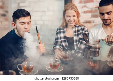 Rest In Hookah, Man Makes Tornado Out Of Smoke Shisha, Friends Watch And Make Photos.