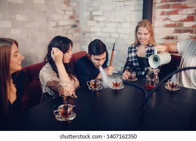 Rest In Hookah, Man Makes Tornado Out Of Smoke Shisha, Friends Watch And Make Photos.