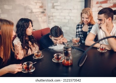 Rest In Hookah, Man Makes Tornado Out Of Smoke Shisha, Friends Watch And Make Photos.