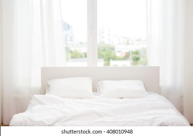 rest, interior, comfort and bedding concept - bed at home bedroom - Shutterstock ID 408010948