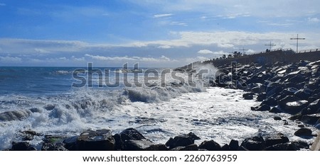 Rest on the sea. Marine background. Mediterranean Sea in Spain. Storm on the sea. Sea foam. Beautiful waves. Stone coast. A big wave. Wave splashes.