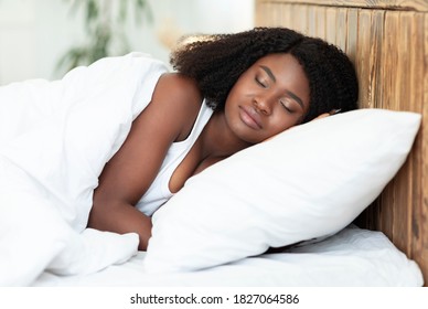 Rest And Relax Concept. Portrait Of Young Beautiful African American Lady Sleeping Single In Comfortable Bed. Wellbeing. Millennial Lady Having Good Nap Alone On Orthopedic Soft White Pillow