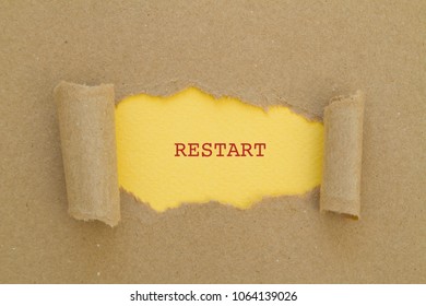 Restart Word Written Under Torn Paper.